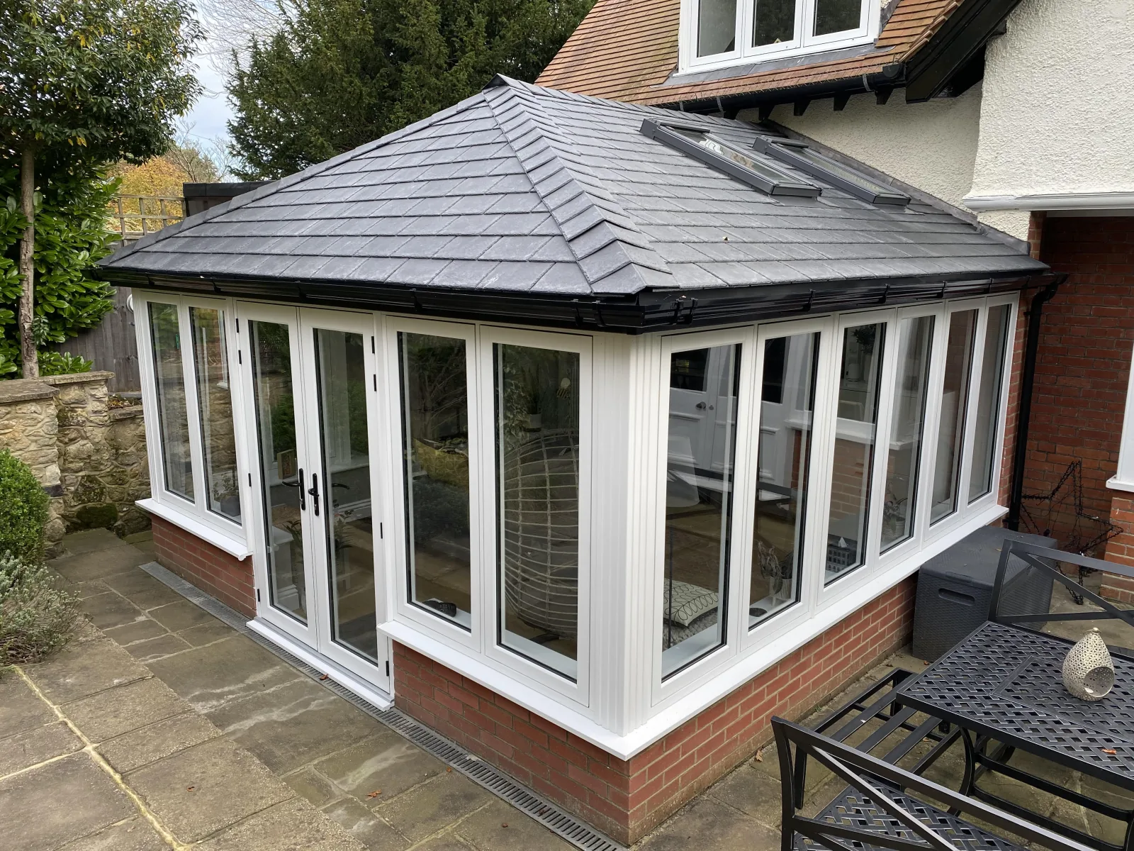 P-shape conservatory with slate Supalite tiled roof and roof vents