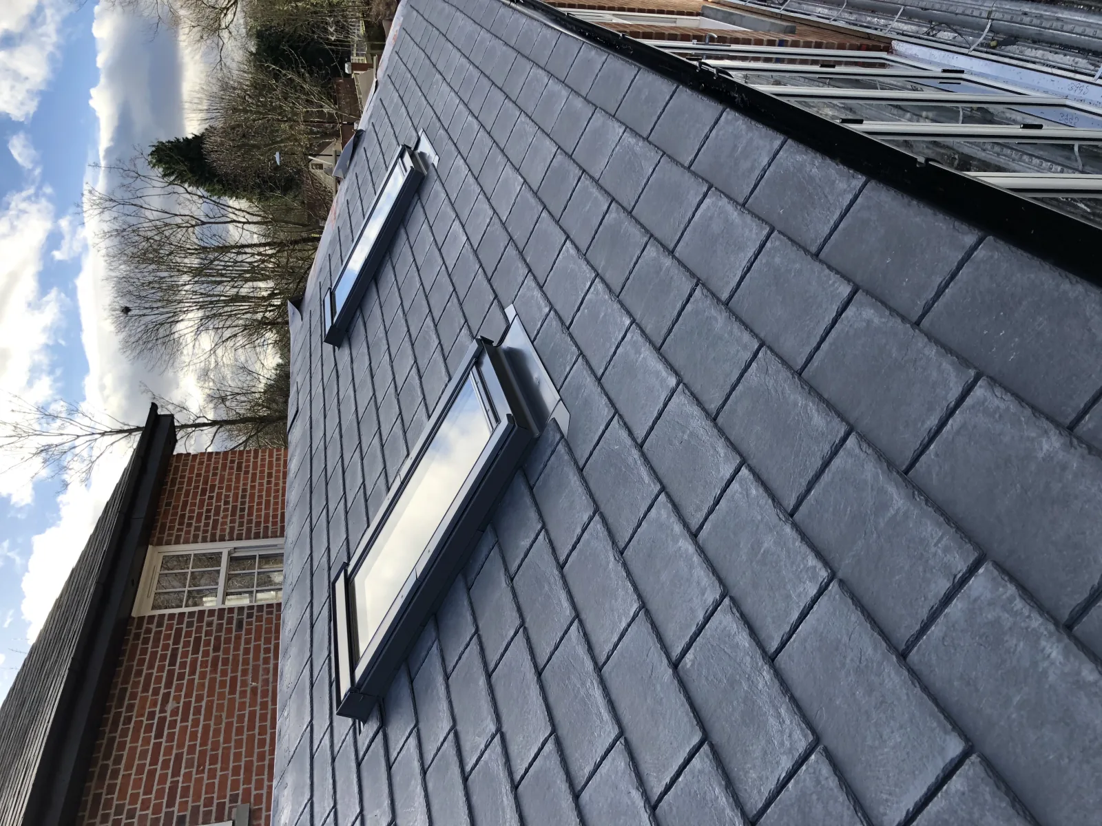 Detached home with Supalite slate tiled conservatory roof