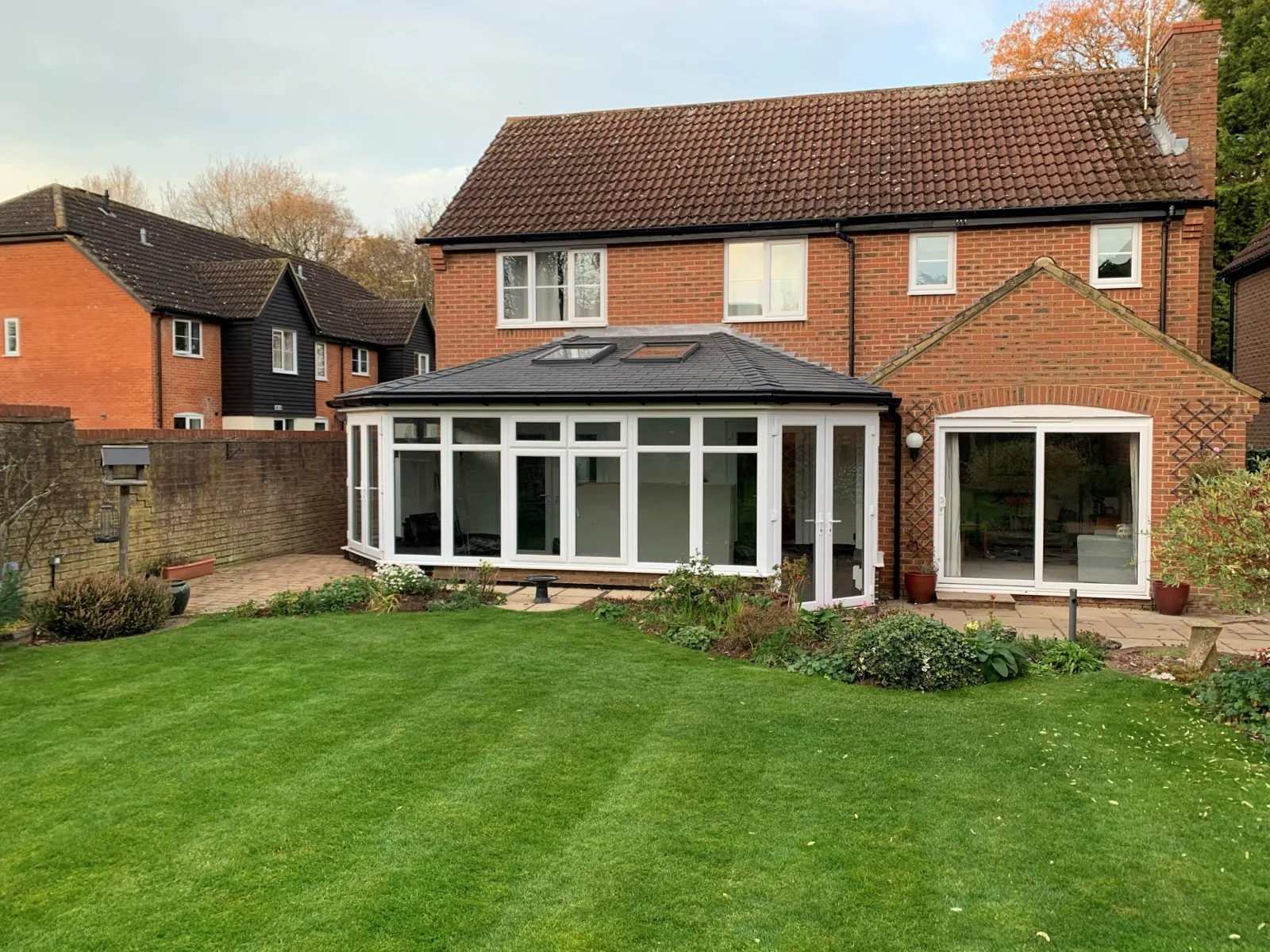 Lean-to conservatory with slate Supalite tiled roof and roof vents