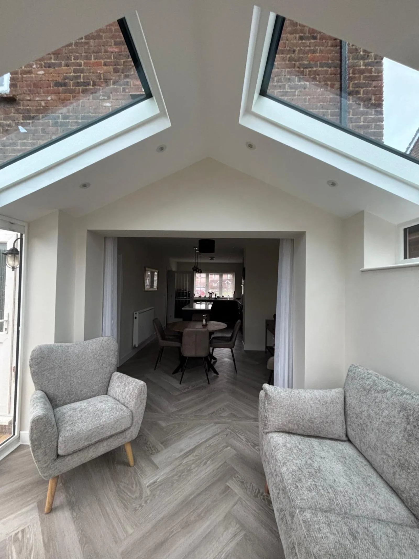 A finished, dressed Supalite conservatory interior with vaulted plastered ceiling — a real lived-in room